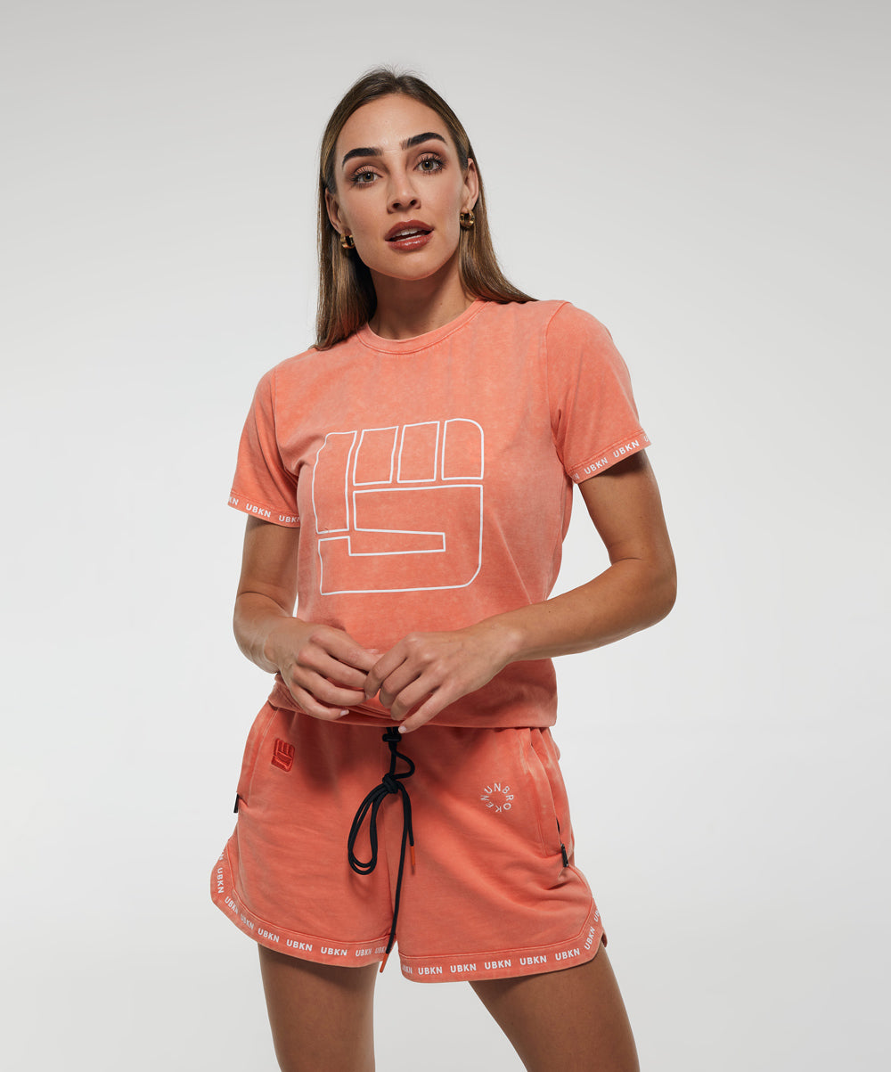 STRENGTH Performance Tee in Coral Wash