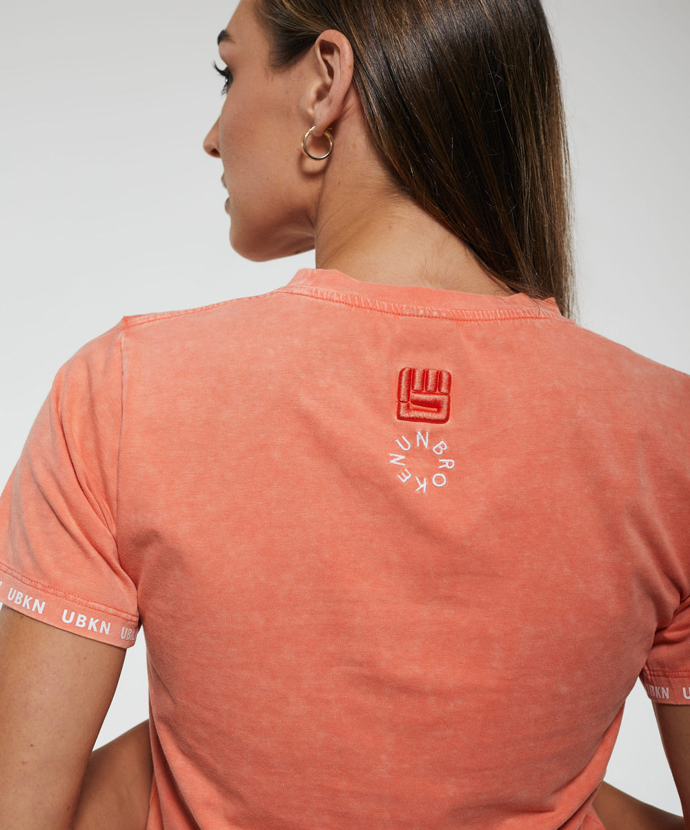 STRENGTH Performance Tee in Coral Wash